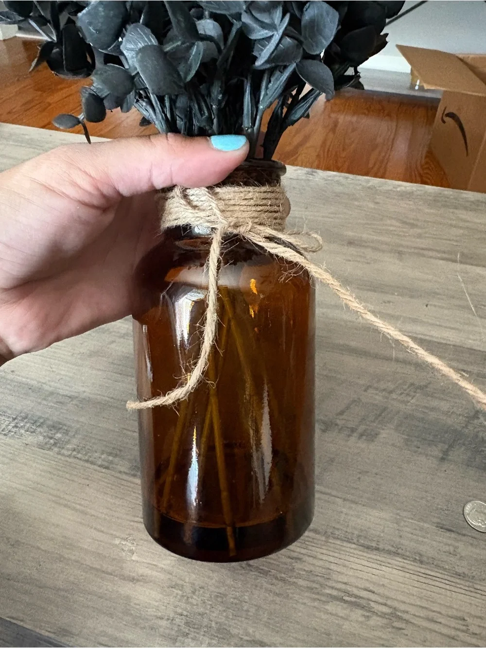 Black Faux Eucalyptus Stems in Amber Glass Vase
